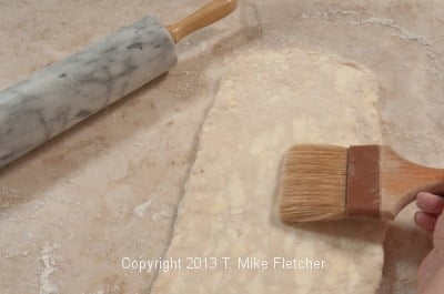 Brushing dough