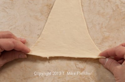 Stretching top of dough for roll