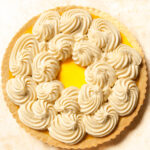 Swirls of Pastry Cream on an Orange Tart.
