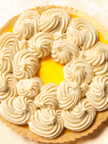 Swirls of Pastry Cream on an Orange Tart.