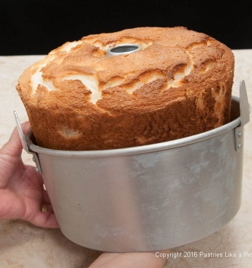 Releasing the rim of the pan for the Angel Food Cake