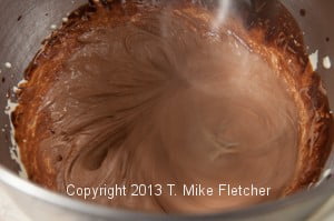 Chocolate in egg yolks mixing