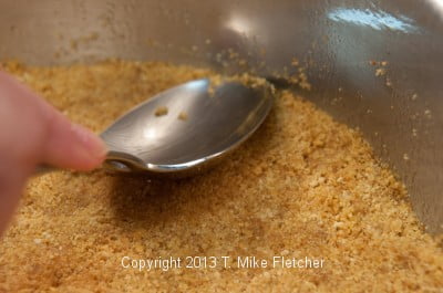 Sealing the crust to the side of the pan