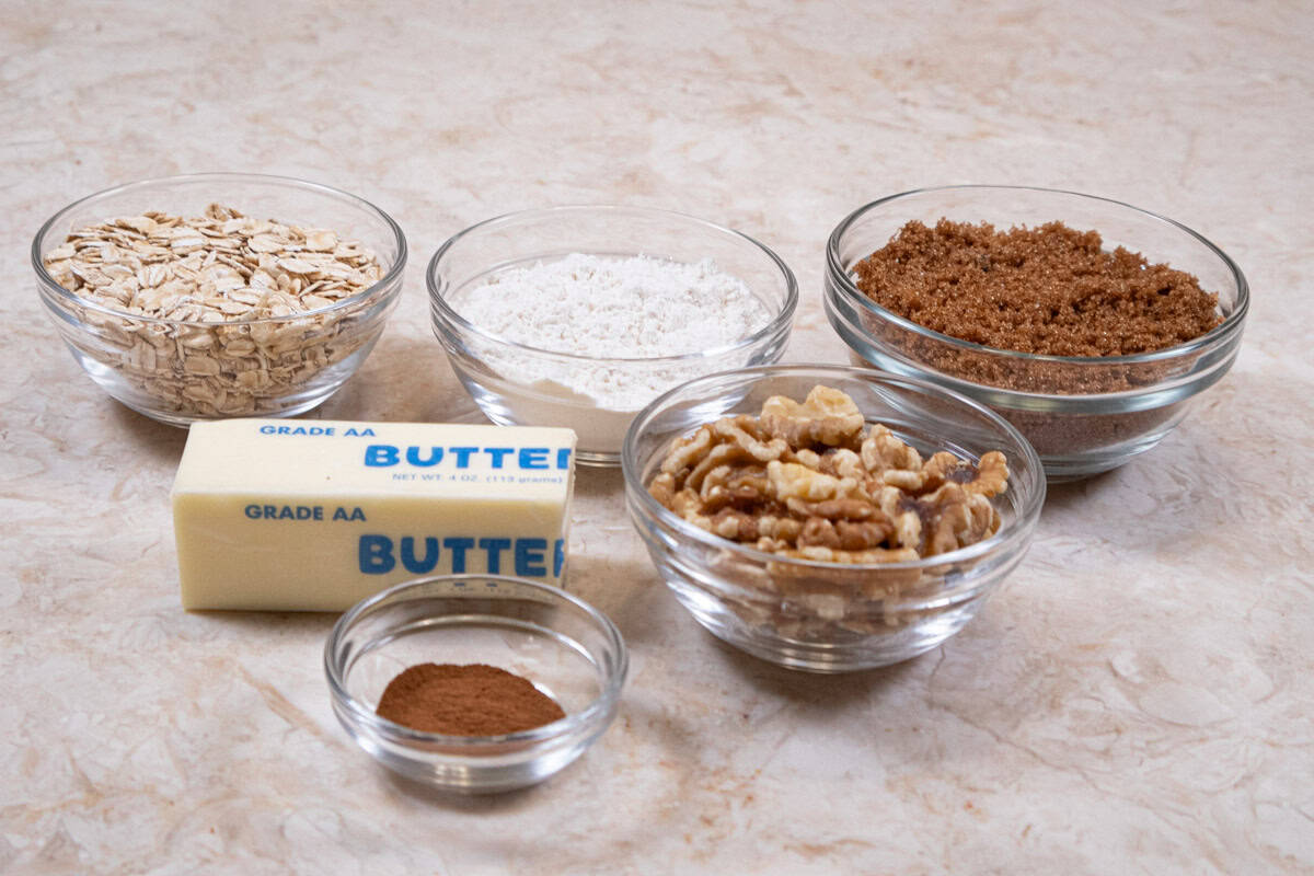 Ingredients for the crisp topping include: regular oats, brown sugar, walnuts, cinnamon, all-purpose flour, and unsalted butter. 