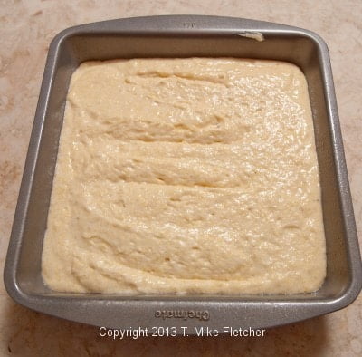 unbaked cornbread in pan