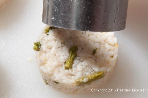 Removing mold for the Lemon Asparagus Risotto Cakes