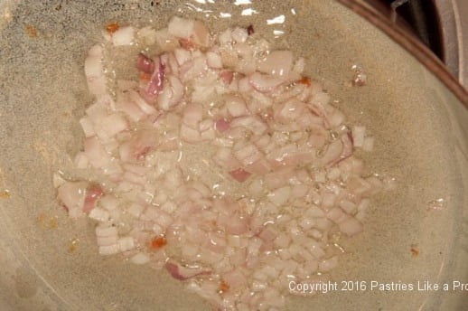 Shallots sautéing in oil for the Lemon Asparagus Risotto Cakes