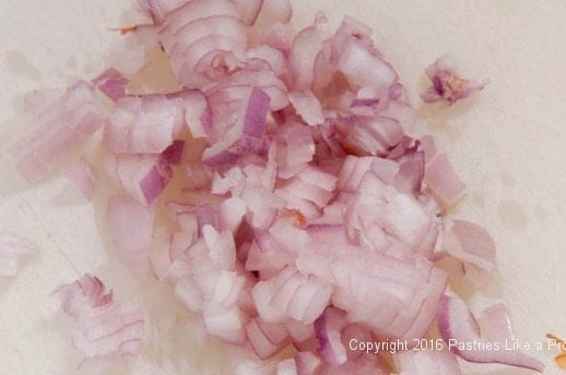 Sliced shallots for the Lemon Asparagus Risotto Cakes