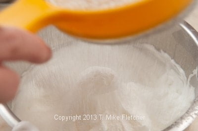 Sifting first flour over