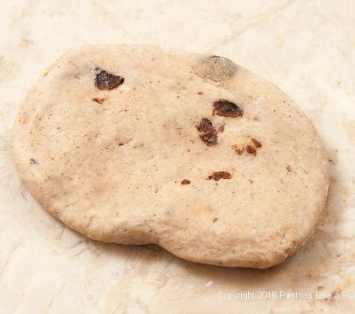 Flatten one piece of dough for Hot Cross Buns