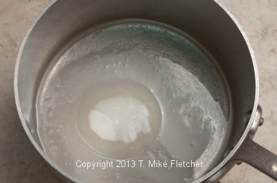  Water and sugar in pan