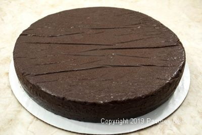 Ultimate Chocolate Fudge Cake baked on a board