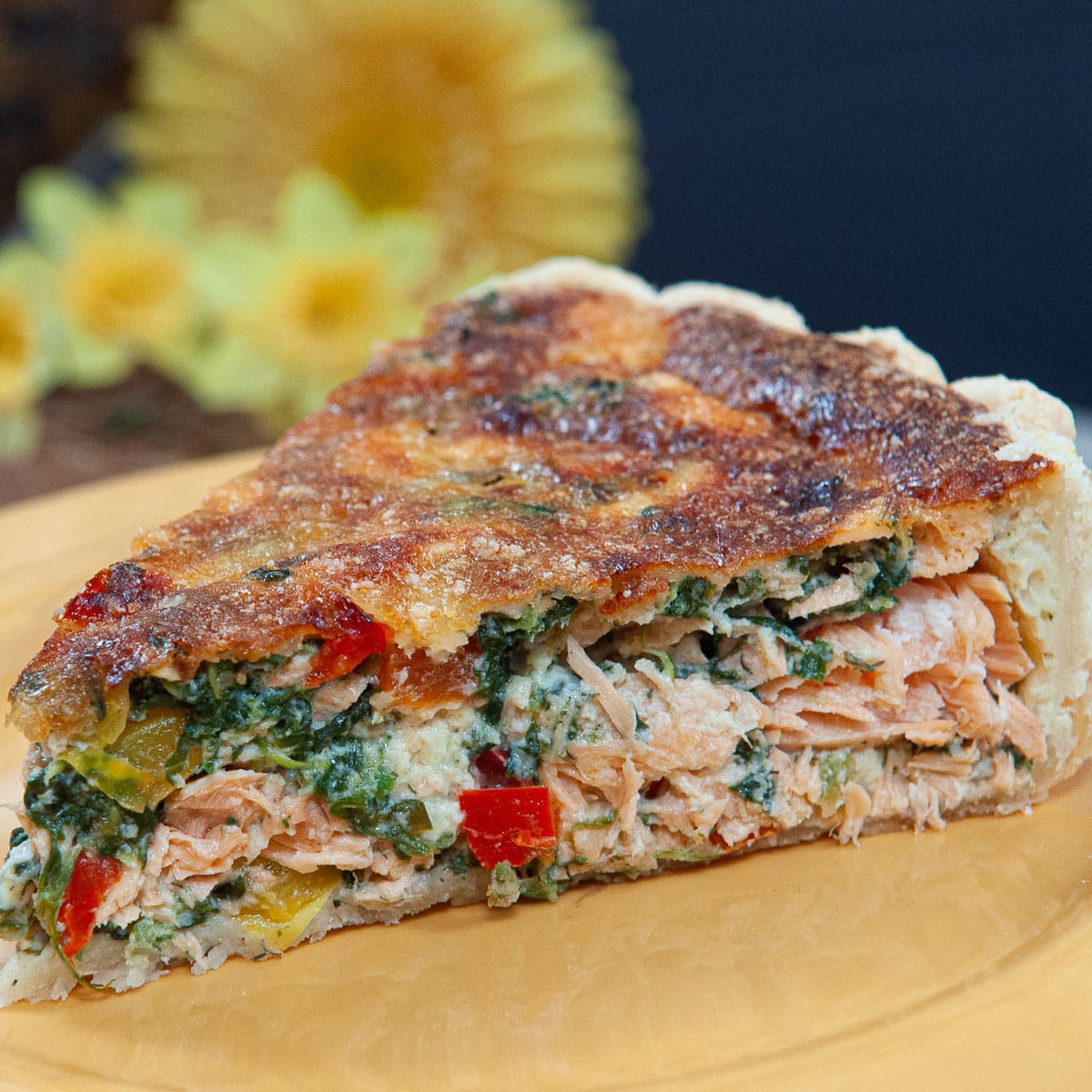 This Salmon Tart features a pate brisee crust filled iwth salmon and vegetables.