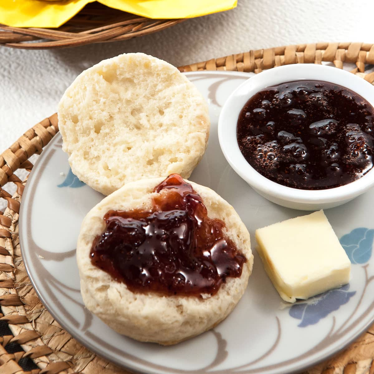 Cream biscuits on a plate with Strawberry Blasamic Jam and butter,