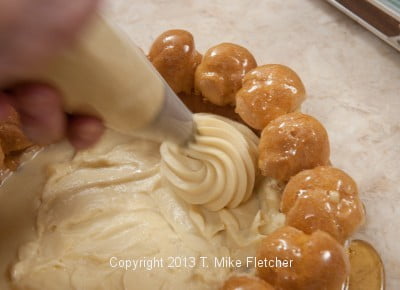 Piping swirls of pastry cream