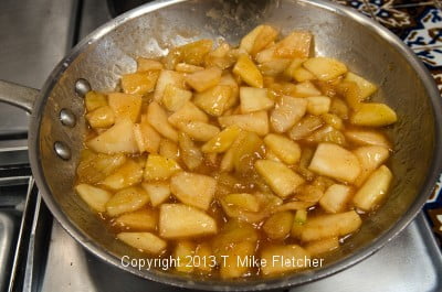 Cooked apples in pan