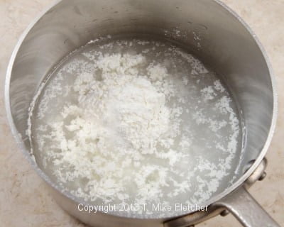 Water, sugar, cornstarch in pan
