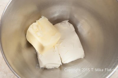 butter, cream cheese in mixer bowl