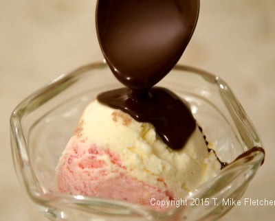 Magic Shell being poured over ice cream