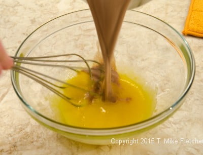 Adding chocolate to egg yolks