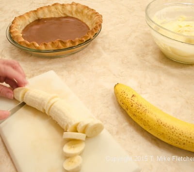 Slicing bananas for Double Banana Caramel Cream Pie