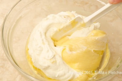 Folding together the pastry cream and whipping cream for Double Banana Caramel Cream Pie