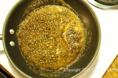 Brown sugar and butter boiling for The Pina Colada Cake