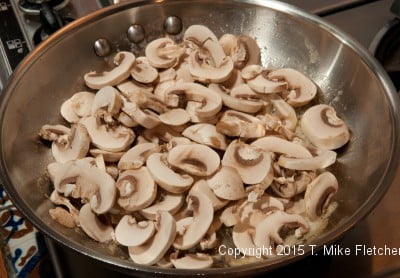 Mushrooms in pan for Seafood Crepes