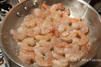 Raw shrimp in pan for Seafood Crepes