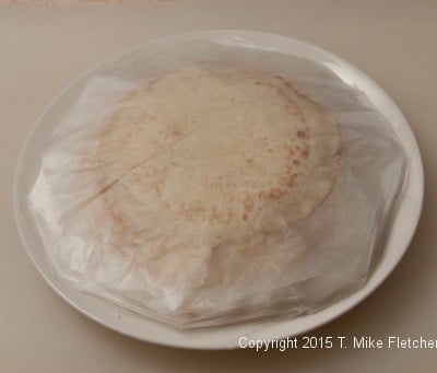 Stack of crepes between waxed paper for All Purpose Crepes