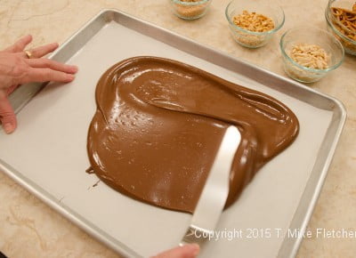 Chocolate being spread for TJ's Cowboy Bark