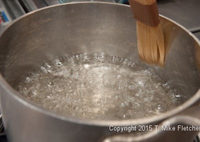 Washing down sides of pan for Hazelnut Crunch Bars