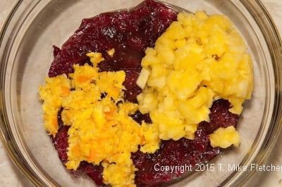 All ingredients in a bowl for the Cranberry Fresh Pineapple Relish