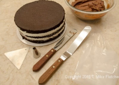 Cake and tools to finish the Double Chocolate Mousse Cake