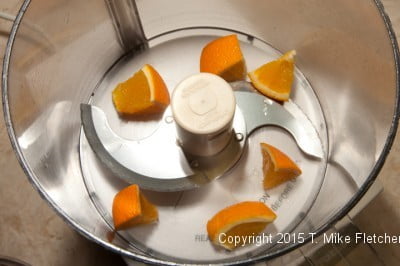 Orange segments in the food processor for Cranberry Fresh Pineapple Relish
