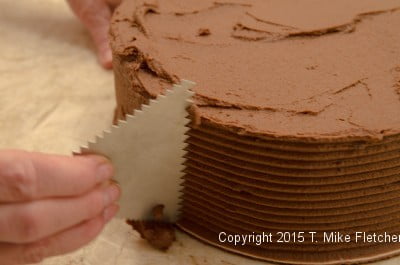 Combing the side of the Double Chocolate Mousse Cake
