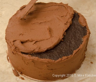 Finishing the top with mousse for the Double Chocolate Mousse Cake