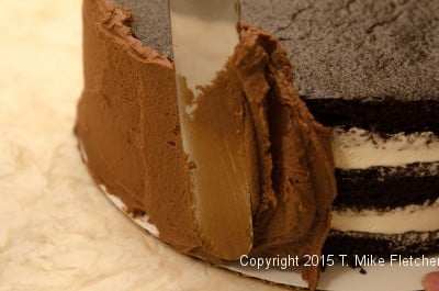 Finishing the side of the Double Chocolate Mousse Cake