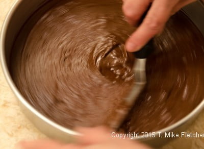 Smoothing the cake layer for the Double Chocolate Mousse Cake