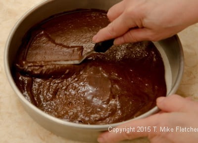 Spreading the batter in a pan for the Double Chocolate Mousse Cake