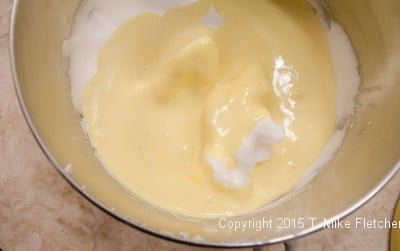 Beaten egg yolks over beaten egg whites for the Buche de Noel