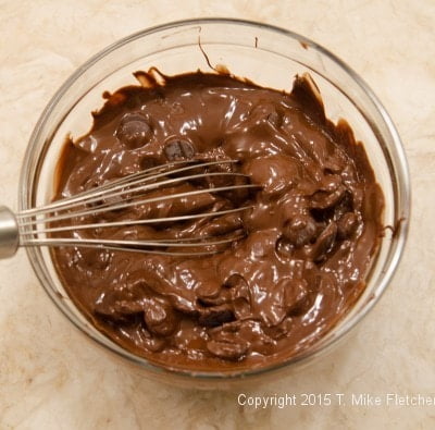 Whisking chocolate for the chocolate buttercream for the Buche de Noel