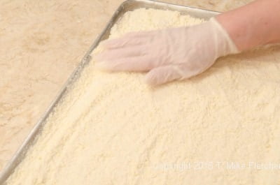 Smoothing crumbs into a corner for the Updated Lemon Bars