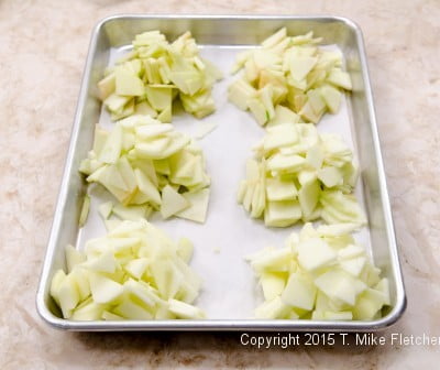 Piles of apples on a tray for Apple Crostatas with Pastry Cream