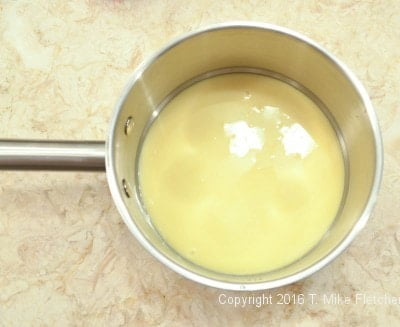 Condensed milk in the pan for the Two Ingredient Fudge Hearts