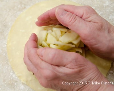 Pile of apples on pastry for Apple Crostatas with Pastry Cream