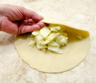 Pastry being turned down for Apple Crostatas with Pastry Cream