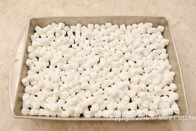 Marshmallows on chocolate for S'Mores Bars