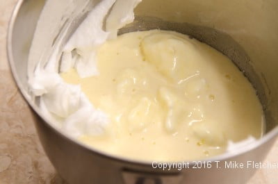 Batter over egg whites for the Lemon Raspberry Pudding Cake
