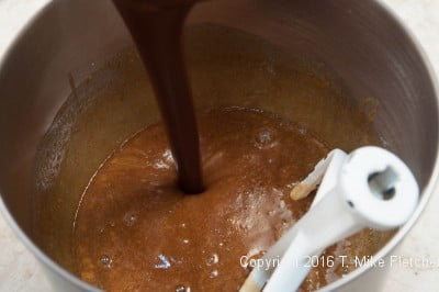 Pouring the chocolate into the batter for the Mocha Kahlua Brownies. 